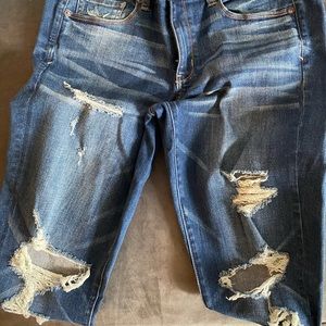 Distressed skinny dark wash jeans.